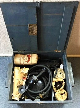 Timber box containing hand lamp [Aldis lamp], resister with cable, switch and plug [lamp was converted to 240v power], envelope containing screen and 5 Mazda light globes. 