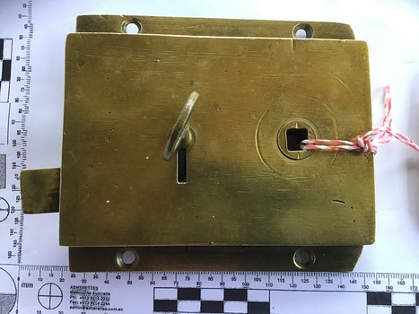 Rear [inside] view of a brass lock with key from the Port and Harbours suction dredge 'Pioneer' used at the Queenscliff creek entrance  