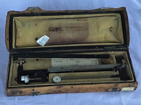 A planimeter in leather box used by P. J. Larkin, government surveyor for measuring irregular areas in plans and charts.