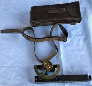 Clinometer in leather case used by J. P. Larkin, government surveyor. This instrument measures slopes and vertical angles.