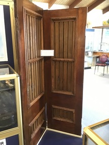 Two timber doors from the 'Victoria Tower' made of teak and mahogany.