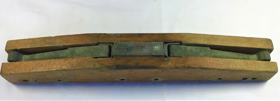 An adjustable rowlock made of a timber block with metal rowlocks which stow away inside the block when not in use.