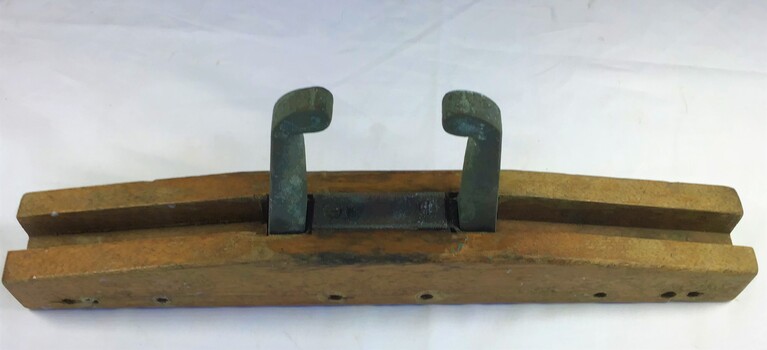 An adjustable rowlock made of a timber block with metal rowlocks which stow away inside the block when not in use.