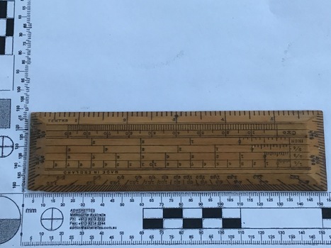 A wooden ruler used for navigational calculations [front views]