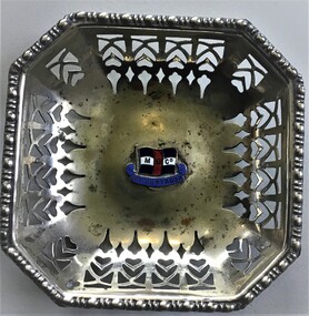 Small metal 8 sided tray with shipping line logo 'M S Co. MV Duntroon' in center raised badge. 
