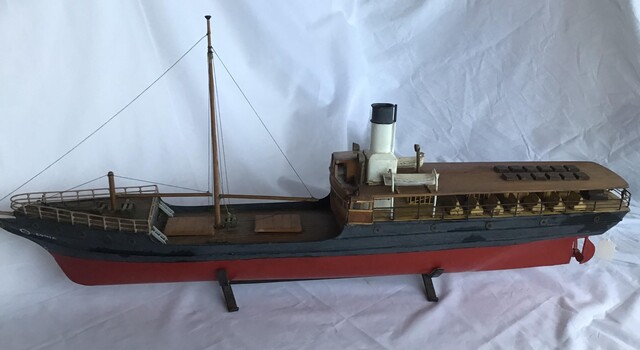 Ship model of the SS Edina on stand. 