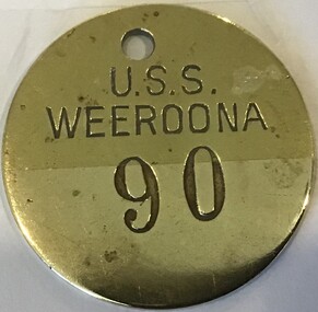 Round brass key tab with stamped lettering: 'U.S.S. Weeroona 90'