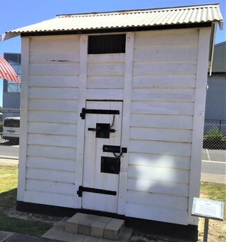 Timber lock-up building with tin roof painted white which used to be the lockup at Queenscliff