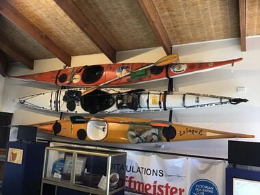 Three sea kayaks on display at the QMM commemorating historic journeys. Orange one was used by Earl de Bonville [Bloomfield] who circumnavigated Tasmania in 1979. Yellow one used by Paul Caffyn in his 1981/2 first circumnavigation of Australia in a sea kayak. White one belonged to Freya Hoffmeister who solo circumnavigated Australia in 2009.
