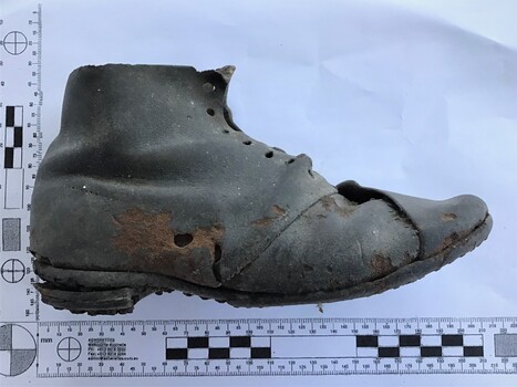 A child's well worn black boot found under the floor of a pilot's terrace house in Gellibrand Street Queenscliff. It is over 170 years old and was probably put there by the family during construction for good luck or to ward off bad luck