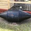 7 assorted marker buoys of various shapes and colours; black, green, red and yellow. Two are made of steel and 5 of fibreglass.
