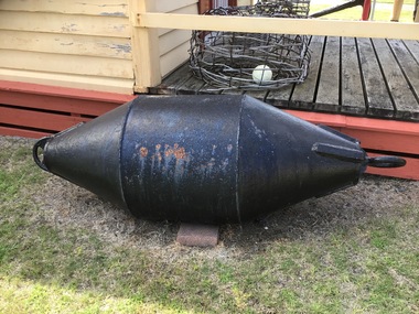 7 assorted marker buoys of various shapes and colours; black, green, red and yellow. Two are made of steel and 5 of fibreglass.