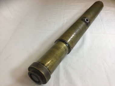 Side view of brass gun sighting telescope