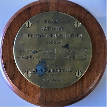 Brass circular plate mounted on round timber base, ex lifeboat 'Queenscliffe' Weyburn engine No.12