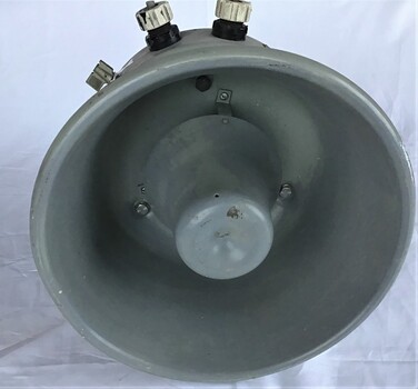 Front and side views of a Public Address Speaker from the HMAS Canberra used to broadcast commands to the ships company. Grey in colour