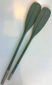 Two paddles painted green