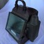Portable compass in metal case with glass front and spirit light compartment on left side.