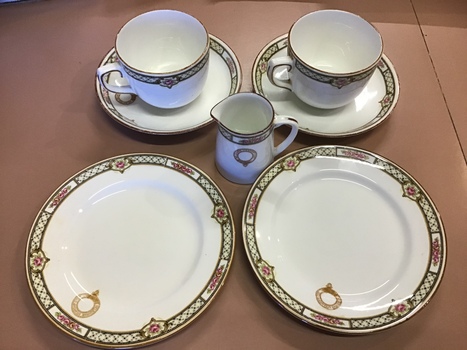 2 tea cups and saucers, 2 side plates, 1 small milk jug all with floral border pattern as used on board the MV Duntroon