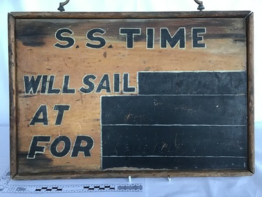 Timber notice board used at the booking office for the SS Time to indicate sailing information