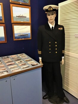 Chief Engineer Merchant Marine uniform.Shirt and shoes are props. Additional two cap insignia and one shoulder insignia.