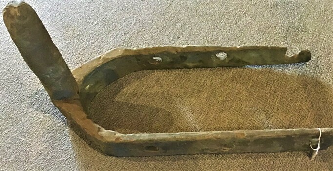 A pair of cast iron gudgeon fittings suitable for a rudder from an unknown wreck