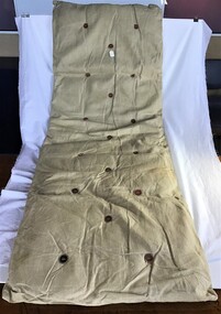 Hammock mattress [palliasse] made of sack cloth with round upholstery buttons made of pieces of round leather. 