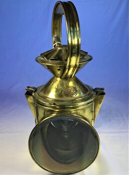 A bras, kerosene fueled lantern with two interchangeable port [red] and starboard [green] glass filters.