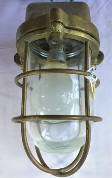 Brass deck light with globe and electric lead attached when it was converted to 240V