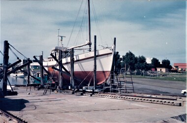 Colour photo of the fishing boat 'Pamlorie' on the hard at the Queenscliffe slipway