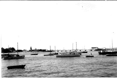 A number of small to medium sized boats seen at anchor including the Ports & Harbour launch "Flinders'