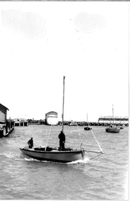 Black & white photograph of the Couta boat "Lila" under way at Fisherman's Pier at Queenscliffe 