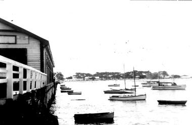 Black & white photograph of moored Couta boats and others