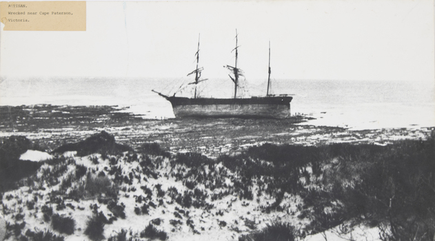 Black and white photograph showing sailing vessel 'Artisan' aground near Cape Paterson, Victoria