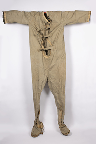 An early full body diving suit, head cap, goggles and photo of user in the 1940s,
