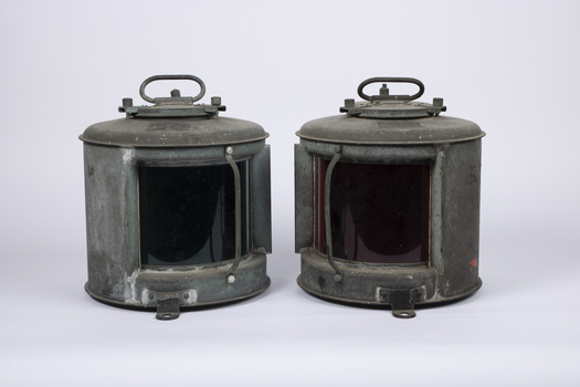 Three navigational light canasters, Port with red glass and starboard with green glass and head light with clear glass.