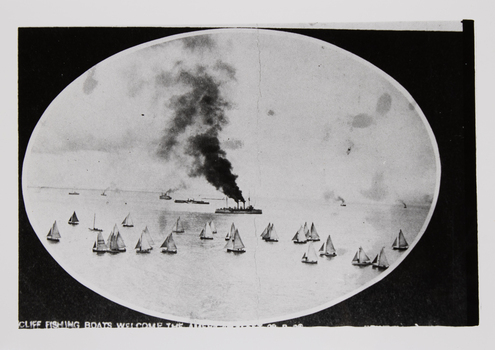 A photograph of an early photograph mounted on an oval mat showing the Queenscliff fishing fleet welcoming the American Fleet into Port Phillip.