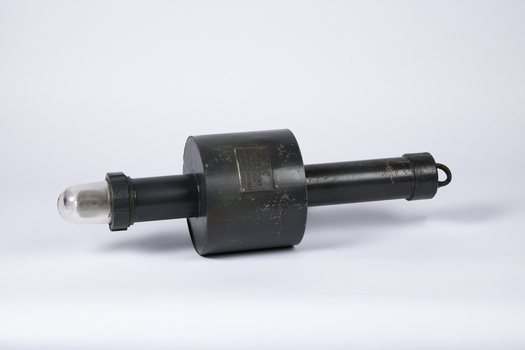 A black, metal, cylindrical floatation device with battery operated light.
