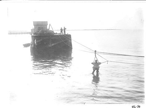 Black & white photograph of Rocket rescue practice with breeches buoy system