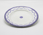 White Star Line china plate with blue edge design and central logo.
