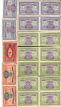 A collection of fuel ration tickets in various colours depicting the volume allowed per ticket and the expiry date 1941