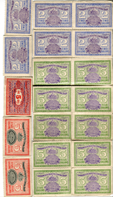 A collection of fuel ration tickets in various colours depicting the volume allowed per ticket and the expiry date 1941