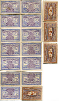 A collection of fuel ration tickets in various colours depicting the volume allowed per ticket and the expiry date 1941