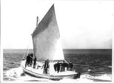 Black & white photo of Queenscliffe Life boat under a gaff-rigged sail
