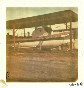 Colour photo of the Queenscliffe lifeboat under temporary cover at the QMM site