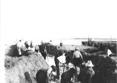 Black & white photo - Boat Channel - Men digging in watered trench with shovels
