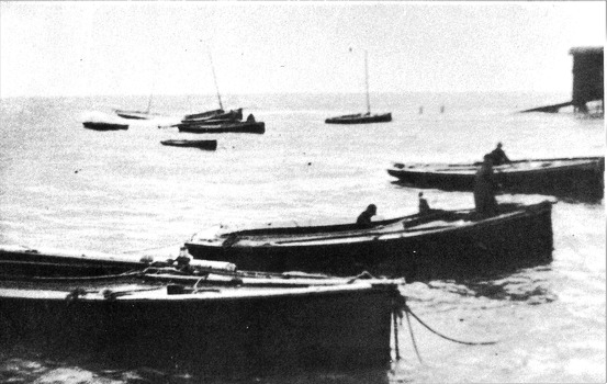 Black & white photograph of the Queenscliffe Couta boat fleet sheltering from a Sou'Wester.