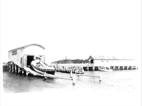 Black & white photo of the winching up the LB Queenscliffe into the LB shed