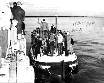 Black & white photograph of the life boat Queenscliffe & rescued 'TIME' crew.