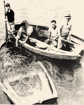 black & white photo of the sunken dinghy used to rescue crew