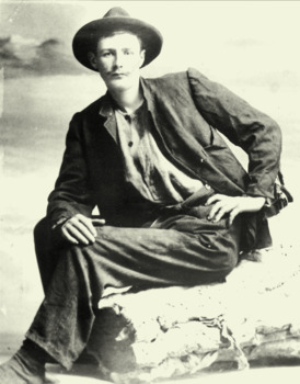 Black & white photo of William Ferrier sitting on a log.